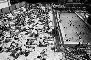 People enjoying the hot weather at the Oasis outdoor swimming pool Lido, London