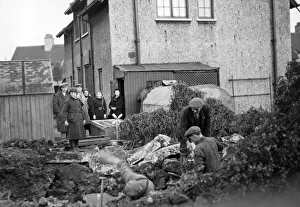 Shelter Prints: People of James Reckitt Avenue, Hull, Yorkshire, look as the men dig the garden