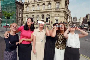 People in Liverpool city centre watching the solar eclipse. 11th August 1999