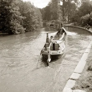 Narrow Boats Prints: People steering their narrow boats along the canal, with People fishing along