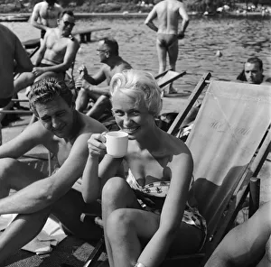People sunbathing in a heatwave at the Serpentine Lido, Hyde Park, London