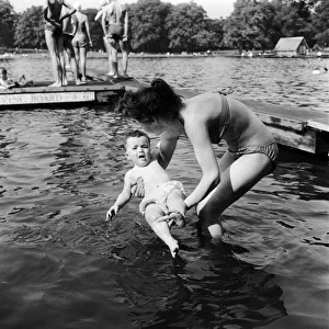 People sunbathing in a heatwave at the Serpentine Lido, Hyde Park, London