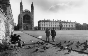 University Prints: People talking a walk on the lawn outside Kings College in central Cambridge