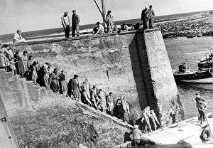 Fishermen Prints: People waiting for a sightseeing trip in Seahouses in Northumberland. c1960