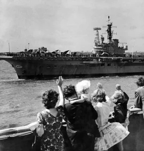 Carrier Prints: People waving at the visiting aircraft carrier HMS Centaur. Liverpool, Merseyside