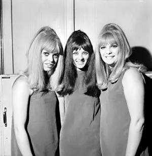 00031 Prints: People Women: Three girls wearing mini dresses smile into the camera
