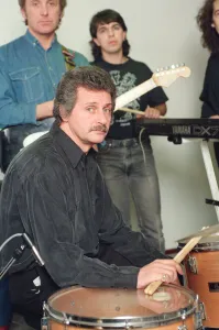 Pete Best, (in the black shirt holding his drum sticks) posing for the camera with his