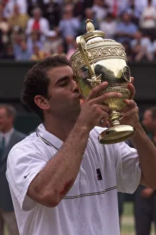 Winner Prints: Pete Sampras kisses trophy after victory at Wimbledon 1999 after beating Andre Agassi in