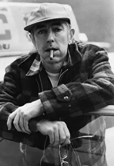 01428 Prints: Peter Cook, satirist pictured smoking a cigar - April 1980 22 / 04 / 1980