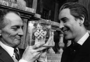 Peter Cushing actor (L) with Queens Award for Industry awarded to Hammer Films with