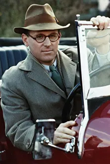 Trilbys Prints: Peter Davison actor sitting in the car open hood- December 1988