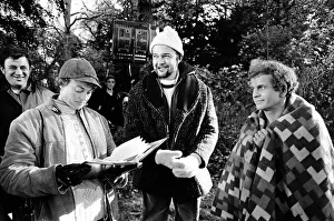 Peter Hall (centre) seen here with members of the film crew and Ian Holm (right