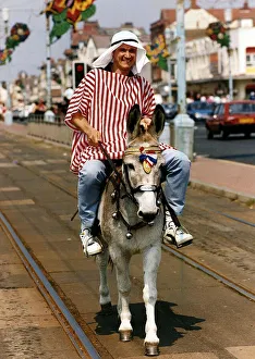 Peter Howitt Actor from BBC series Bread'riding Donkey on Streets of