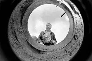 Manhole Prints: Peter McInally has thrown up a teaching career for a daily date with a Corporation