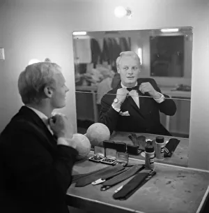 00254 Prints: Peter Mellor, Burnley goalie and male model in the drssing room before a fashion show