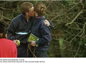 Peter Phillips gives his mother Princess Anne a kiss at his college rugby match