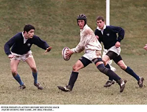 Rugby Ground Prints: Peter Phillips playing rugby wearing head support holding ball