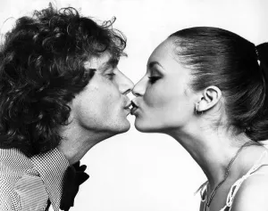 Peter Powell from Radio One and Model Geraldine seen here kissing for Daily Mirror