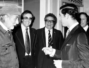 Princes Prints: Peter Sellers and his two partners from the Goons meet Prince Charles at a function