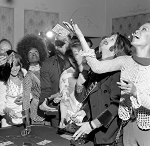 Roulette Prints: Peter Sellers and Ringo Starr have a go at roulette at the Thank you Press party at Les
