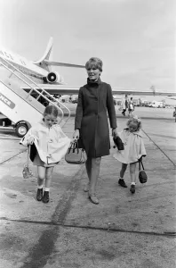 Petula Clark arriving at London Airport from Paris with her two children, Barbara, 4
