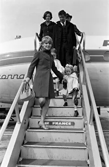 Petula Clark arriving at London Airport from Paris with her two children, Barbara, 4