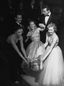 1952 Prints: Petula Clark gets a lift on her 20th birthday from Joan Collins Richard Todd Maxwell Reed