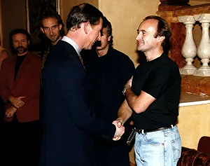 Phil Collins meeting Prince Charles after a one off concert at the royal abert hall
