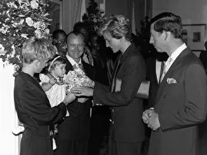 00185 Prints: Phil Collins singer with wife Jill and daughter Lily in 1990 meet Princess Diana
