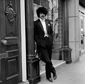 Images Dated 17th January 1983: Phil Lynott of Thin Lizzy modelling clothes from Saville Row, London