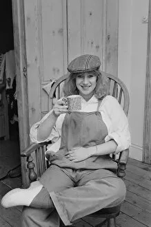 01000 Collection: Photo shows Helen Mirren seated in her country Windsor chair wearing her favourite cap