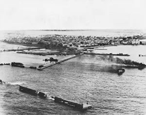 Sunk Prints: The photograph shows the shattered waterfront of the main supply port of Benghazi