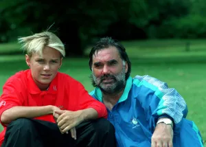 Professional Prints: PHOTOSHOOT OF GEORGE BEST SITTING IN PARK WITH SON CALLUM BEST - 93 / 7487 C