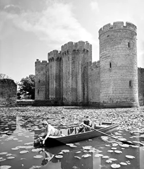 Castles Prints: picking water lillies at Bodium castle moat Kent July 1944 boat architecture