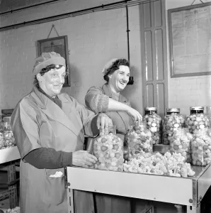 Preparation Prints: Pickle Packers: Pickle packers placing onions in jars. 1954 A156-004