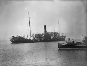 Italian Prints: Picture shows 8, 441 tons The Domala, an Italian Liner, after it was bombed off