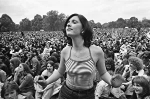 Picture shows a fan dancing amongst the huge audience at London Hyde Park for a concert