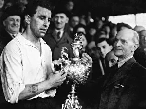 00606 Prints: PICTURE SHOWS: Mr E. J. Morgan (vice-president) presenting the Welsh Cup to Roy Paul