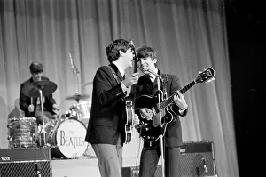 Picture shows Paul McCartney (left) and George Harrison (right) sharing the microphone