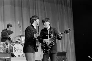 Picture shows Paul McCartney (left) and George Harrison (right) sharing the microphone