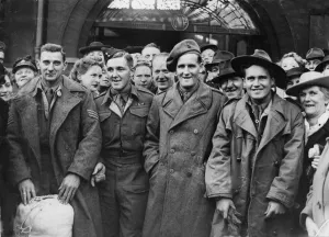 Comrades Prints: Picture shows three Welsh soldiers at possibly Cardiff railway station
