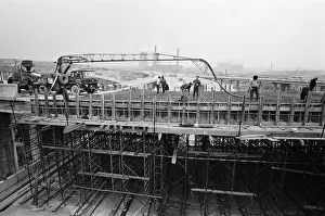 Motorway Prints: Pictured, workmen put last minute touches to a section of the M6 Gravelly Hill
