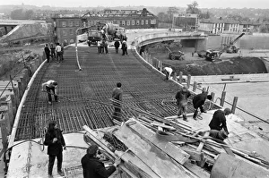 Pictured, workmen put last minute touches to a section of the M6 Gravelly Hill
