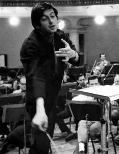 Pictures of conductor Andre Previn in action during a record session with the London