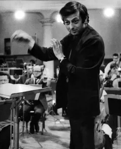 Pictures of conductor Andre Previn in action during a record session with the London