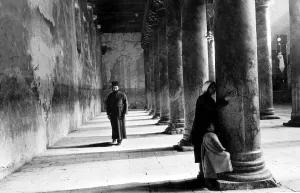 Israel Prints: A Pilgrim Widow and child kisses the pillars on entering the church of Nativity in