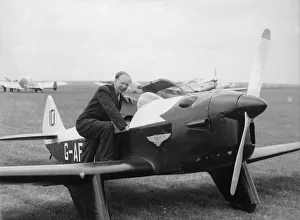 Plane Prints: Pilot climbing aboard a Chilton DW1A aircraft at Bagington Circa 1960
