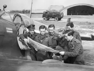 00505 Prints: Pilots of No 132 Squadron with their CO, Squadron Leader Alan Page (holding map)
