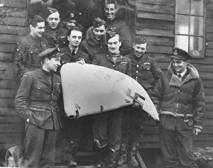 Air Force Prints: Pilots from 501 squadron show off the tailplane rudder of a Messerschmitt 109 at RAF