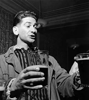 A pint of Beer whilst watching a Shakespeare play at a theatre